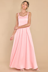 Front view of this dress that features a sweetheart neckline and a satin like material throughout.
