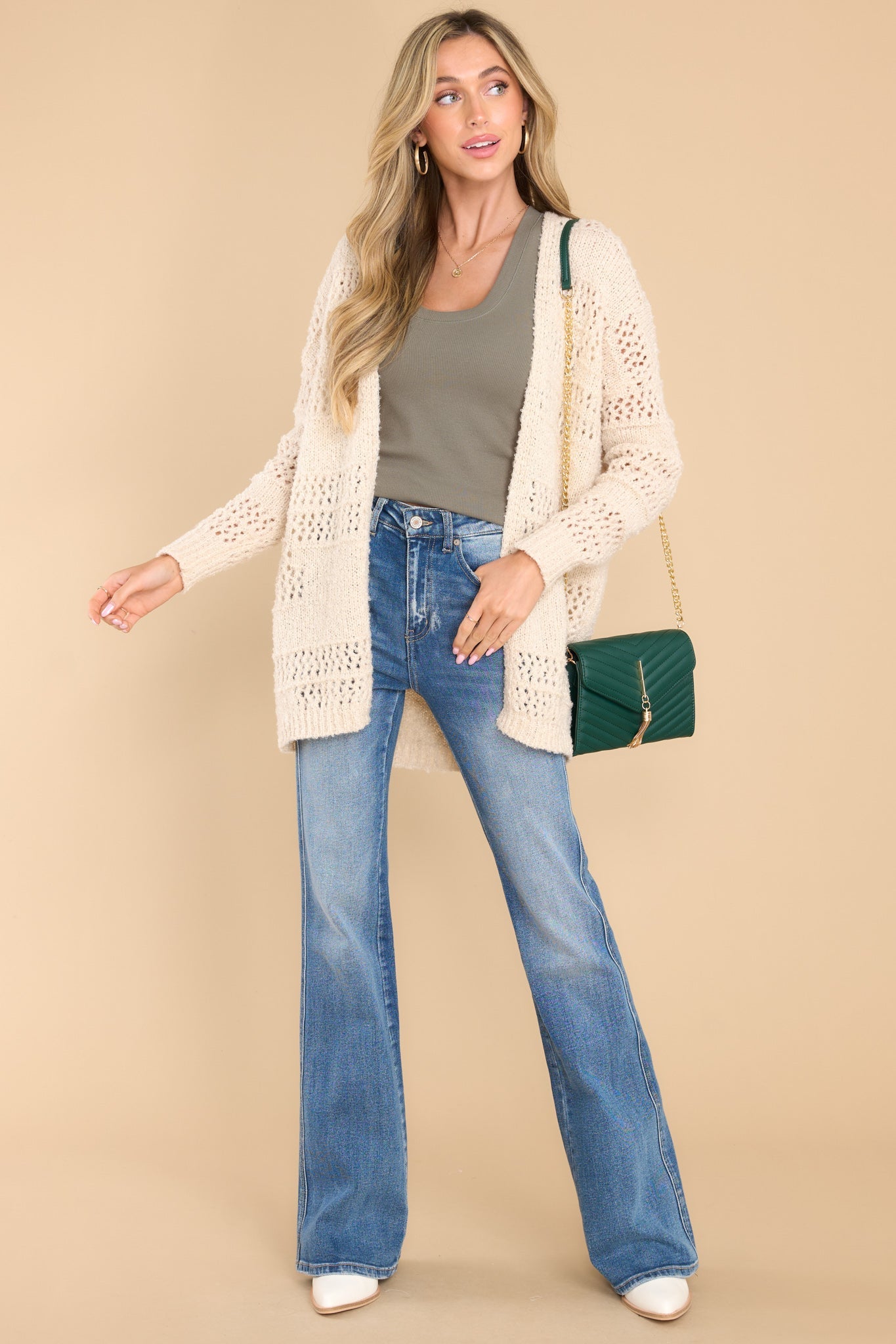 Front view of  this cardigan that features a textured design, ribbed detailing, and a soft fabric.