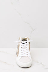Front view of these sneakers that feature a glittered body with star studs along the side, standard lace-up front, white laces, textile interior, a glitter base and side zipper.