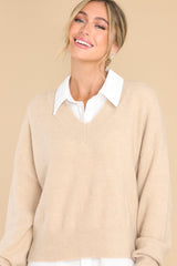 Front view of this sweater that features a v-cut neckline, long sleeves, and a ribbed waistband.