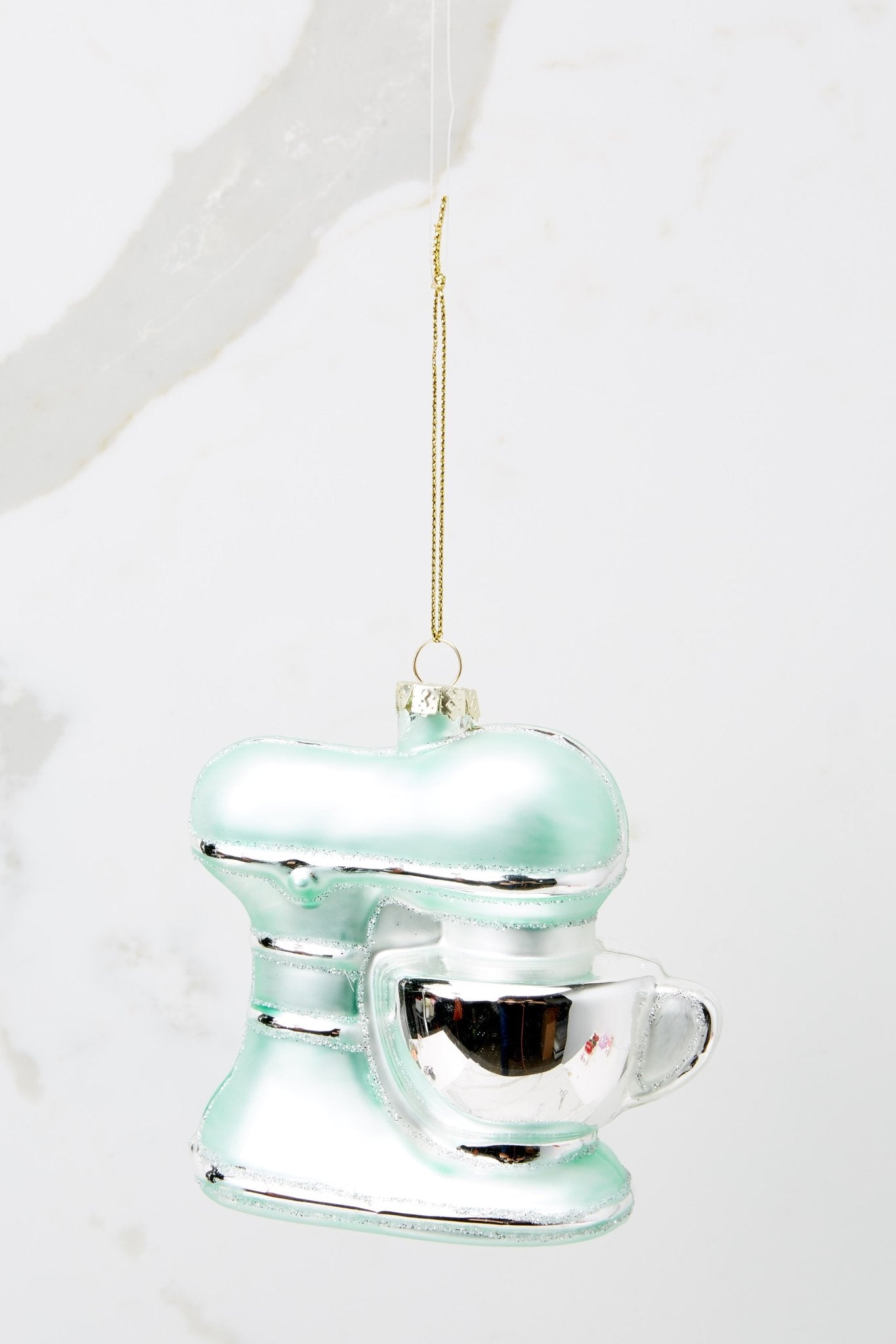 This turquoise ornament features a stand mixer design with a silver bowl.