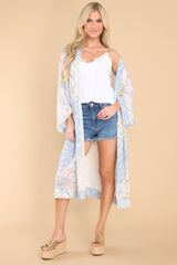 Full body view of this coverup that features an intended wide and flowy fit.