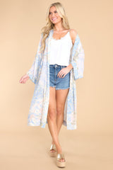 This blue coverup features an intended wide and flowy fit, and a sheer lightweight fabric.