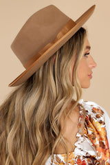 Side view of this hat that features a teardrop crown with an upturned brim and a band around the crown.