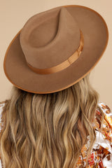 Back view of this hat that features a teardrop crown with an upturned brim and a band around the crown.