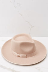 Top view of this hat that features a teardrop crown with a stiff upturned brim and a band around the crown.