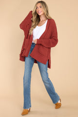 Full body view of this cardigan that features a soft, chunky knit design, functional pockets, and small slits up the sides.