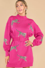 Front view of this sweater dress that showcases the printed cheetahs on the fabric.