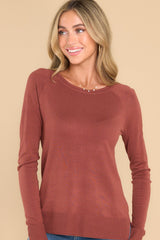 Front view of this top that features a round neckline, ribbed detailing along the hem and cuffs, 3