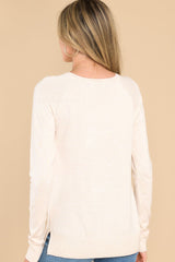 Back view of this top that features a round neckline, ribbed detailing along the hem and cuffs, 3
