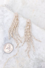 Gold earrings compared to quarter for actual size. Earrings measure 3.5