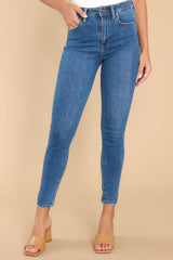 Front shot of these skinny jeans that feature a high waisted fit, functional front and back pockets, and a relaxed fit around the ankles.