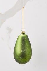 Back view of urse. Ornament features a sparkly green avocado.