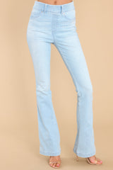 Front view of these jeans that feature flared legs, decorative front pockets, functional back pockets, and belt loops.
