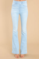Front view of these jeans that feature flared legs, decorative front pockets, and belt loops.