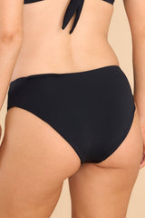 Back view of these bottoms that feature a low-rise and a stretchy material.
