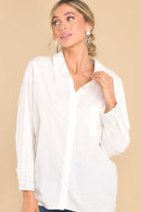 Front view of this top that features a collared neckline, functional buttons down the front and a relaxed fit.