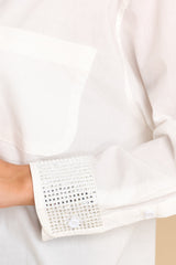 Close up view of this top that features rhinestones on the cuffs.