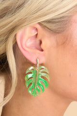 These green earrings feature a lightweight leaf design, gold hardware, and a secure post backing.