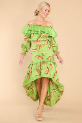 Full body view of this skirt that features a high waist, zipper down the side, and a tiered flowy high low silhouette.