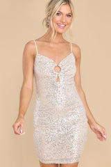 Front view of this dress that features adjustable straps and a ring cutout detail,.