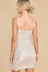 Back view of this dress that features adjustable straps, a ring cutout detail, and a zip up back.