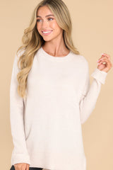 Front view of this sweater that features a crew neckline, a ribbed hem and sleeve cuffs, and 3.5