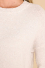 Close up view of this sweater that features a crew neckline, a ribbed hem and sleeve cuffs, 3.5