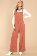 Full body view of these overalls that feature a corduroy texture throughout.