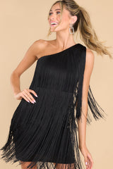 Front view of this dress that showcases how the tassels move in a swaying motion.