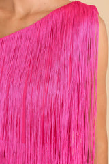 Close up view of this dress that features a one shoulder design with fringe.