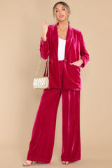 Full body view of these pants that feature a high waist velvet-like material.