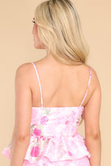 Back view of this top that features a sweetheart neckline, adjustable straps, a side zipper, and a frilled out bottom hem.