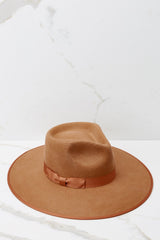 Angled top view of this fedora that features a stiffened wool hat complete with rigid crown design and rim trimmed with tonal gross grain ribbon.