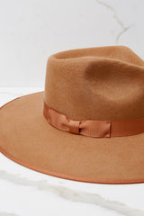 Close up view of this fedora that features a stiffened wool hat complete with rigid crown design and rim trimmed with tonal gross grain ribbon.