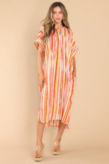 Full body view of this dress that features the vertical striped pattern of the fabric.