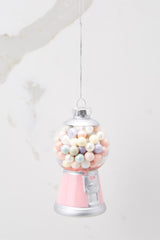 This pink and silver ornament features detached fake bubblegum pieces inside and hand-painted detailing.