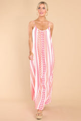 Front view of this dress that features the pink and orange pattern of the fabric.