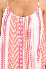 Close up view of this dress that features a scoop neckline, non-adjustable straps, and a flowy fit.