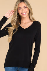 Front view of this top that features a slight v-neckline with a raw hemline, 3.5