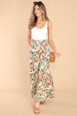 Full body view of these pants that feature an elastic waistband with an adjustable self-tie and a wide-leg, flowy fit.